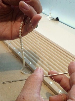 Restringing pearl necklace